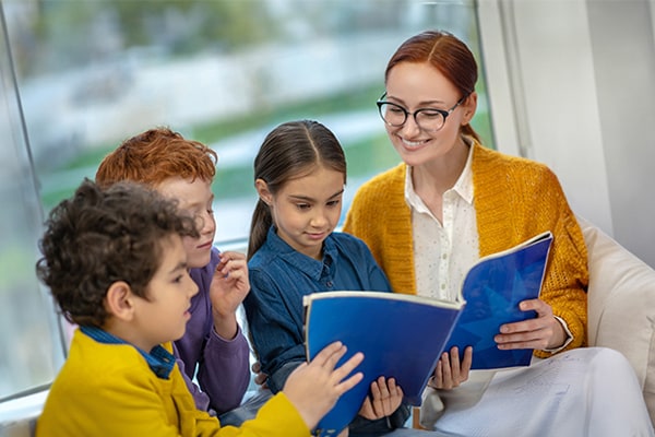 A teacher reading with young children